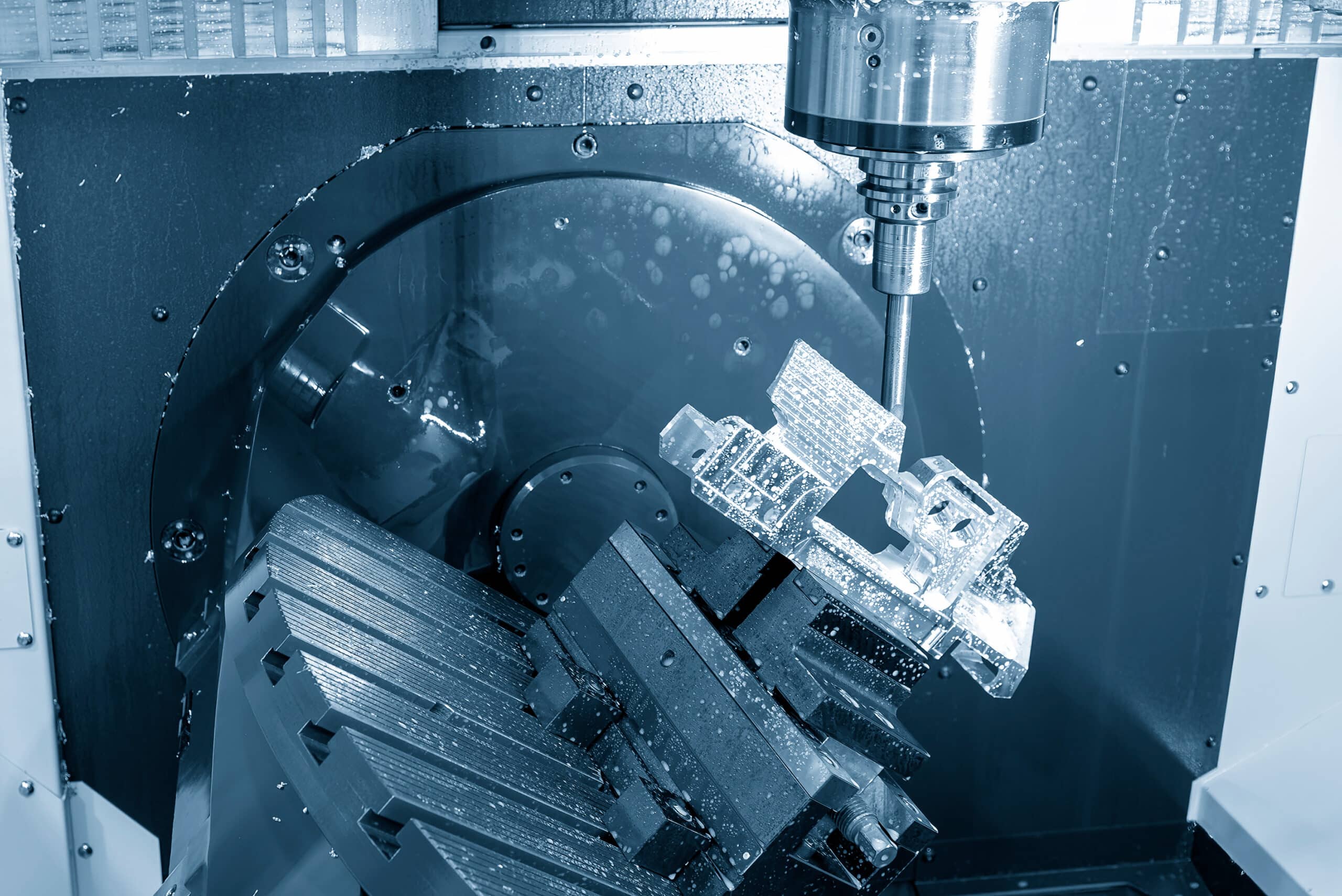 The 5-axis machining center cutting aerospace parts with solid ball end mill tool. The hi-precision automotive manufacturing process by multi-axis CNC milling machine.